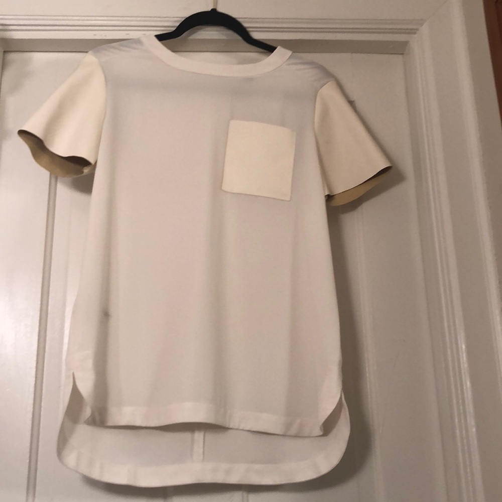 T shirt with faux leather sleeves and pocket